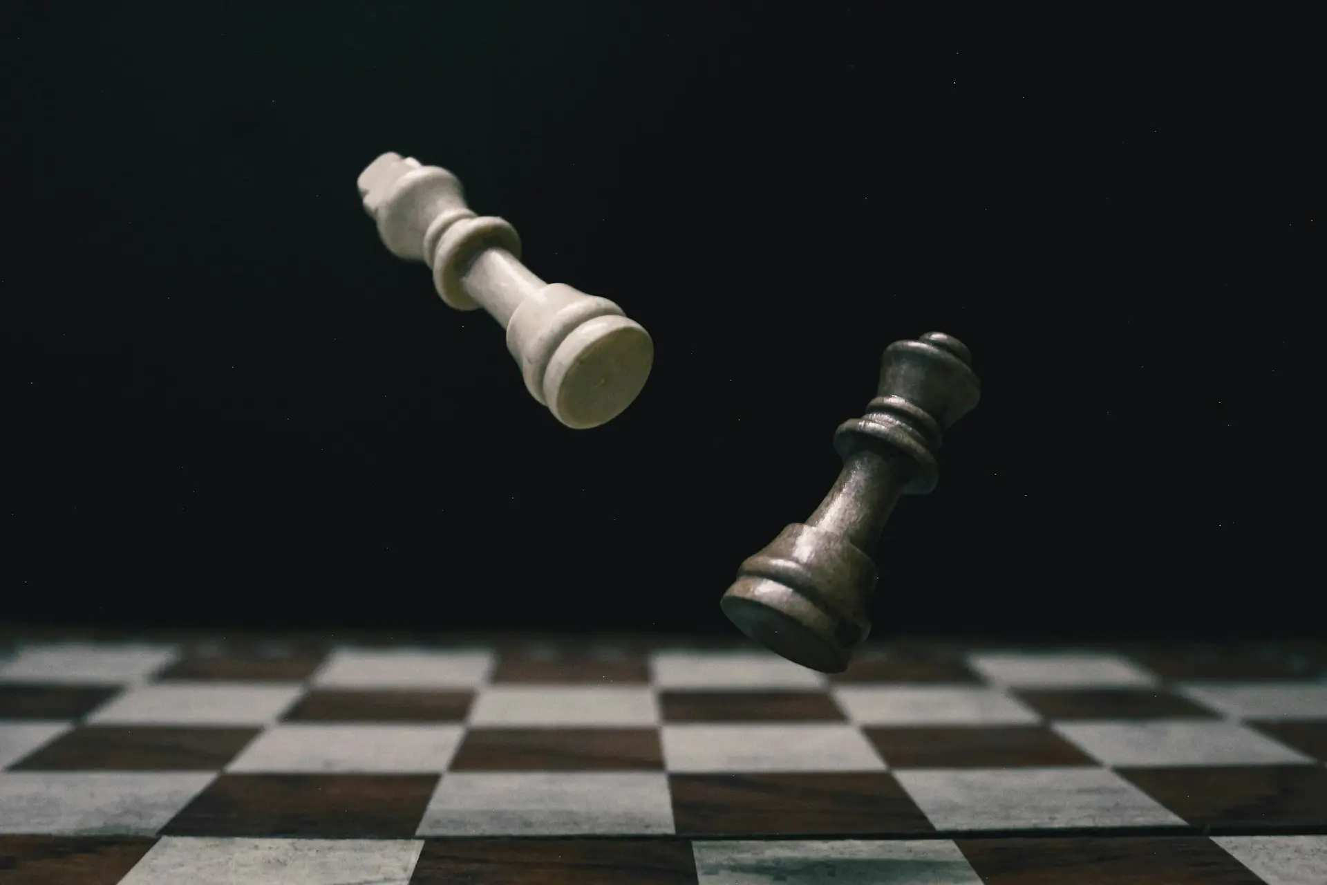 a black and white checkered chess board with a white pawn